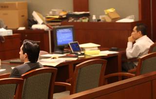 Porfirio Duarte-Hererra (left) and Omar Rueda-Denvers listen Thursday during closing statements in their trial. The men are charged with placing a bomb in a coffee cup and putting it on the truck of Willebaldo Dorantes Antonio, which killed him when it exploded on May 7, 2007.