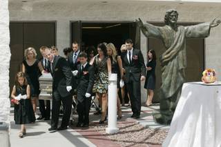 Family members accompany the casket as they file out of the Shrine of the Most Holy Redeemer after the funeral for Station Casinos founder Frank Fertitta Jr. Saturday.
