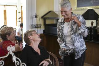 Sally Nelson jokes with Sharon Parkis, right, while modeling the Mary Frances 