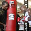 Floyd Mayweather Jr. works the heavybag with his father, Floyd Mayweather Sr. at his Las Vegas gym.