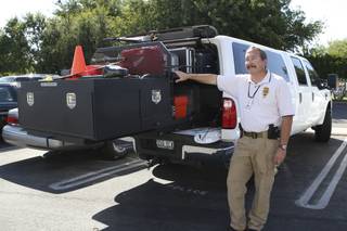 Detective Mark Dubois stands beside the new mobile CSI unit of the Boulder City Police Department. The truck was purchased with drug-seizure funds.