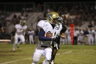 Foothill tight end F.J. Funtila rushes the ball up field past Palo Verde defenders Thursday during a game at Palo Verde. Palo Verde won 49-0.