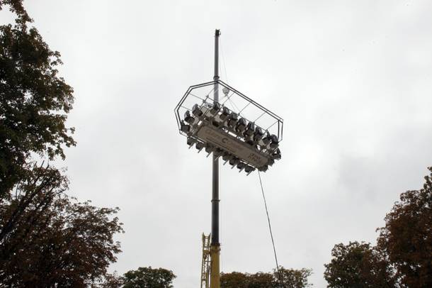 The platform where guests are seated around a table is suspended by a crane at a height of 50 meters above the Tuileries Garden, as part of the presentation of the event