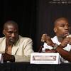 Floyd Mayweather Jr. and his uncle and trainer Roger Mayweather look on during a press conference at the MGM Grand hotel Wednesday.