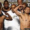 Floyd Mayweather Jr. and Juan Manuel Marquez pose for fans and media members during Friday's official weigh-in. Mayweather Jr. came in two pounds over the 144-pound weight limit and will face a 'significant' financial penalty.