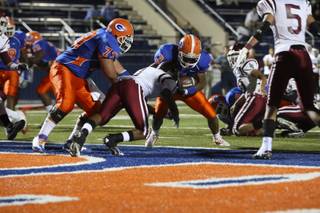 Bishop Gorman running back Shaquille Powell edges into the end zone against Desert Oasis defensive back Elijah Mitchell during the first quarter Thursday night at Bishop Gorman. The Gaels were victorious over the Diamondbacks 42-11.