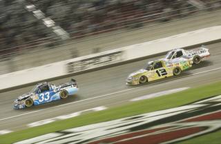 Ron Hornaday (33) is chased down Johnny Sauter (13) and Stacy Compton during the NASCAR Camping World Las Vegas 350 at the Las Vegas Motor Speedway. Sauter won the race.