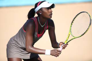 Asia Muhammad prepares to return a serve by Heidi El-Tabakh on Wednesday during the Lexus of Las Vegas Open at Red Rock Country Club. Muhammad won the first set 6-0 and won the match after El-Tabakh could not continue two games into the second set.
