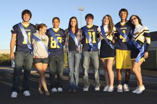 The senior court poses for a photograph for their parents before the start of the homecoming parade Thursday night in Boulder City.