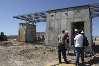 National Park Service employees meet with the construction manager and electrician at the construction site of the entrance fee station at Cottonwood Cove at Lake Mohave. It is one of two new fee stations the National Park Service plans to open by Memorial Day of next year in the Lake Mead National Recreation Area.