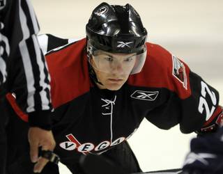 Wranglers veteran Chris Neiszner prepares for a third period faceoff during a preseason game against the Ontario Reign at the Orleans Arena on Thursday night.