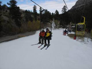 A couple of skiers chat as they ride up chairlift on the beginner hill at the Las Vegas Ski and Snowboard Resort near Mount Charleston. The resort opened at noon on Wednesday, making it the second ski area in the lower 48 states to open this year.
