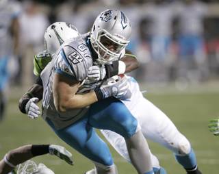 Las Vegas Locomotives tight end Adam Bergen is brought down by the California Redwoods' Dontarrious Thomas during the inaugural game of the UFL on Thursday at Sam Boyd Stadium.