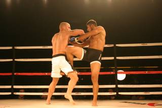 Odiz Ruiz delivers a knee to opponent Mike Dizak during MMA Xplosion at the M Resort.
