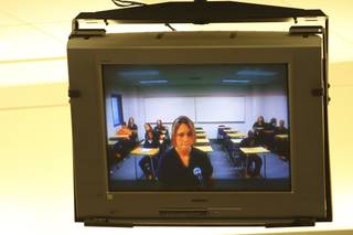 Ericka McElroy appears via video for a status hearing Tuesday in front of Justice of the Peace Tony Abbatangelo. Police said McElroy shot and killed her husband outside their home Oct. 7 after a domestic dispute. 