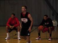 Chace Stanback (left) and Anthony Marshall sit at Monday's UNLV practice at Impact Academy. A sprained left ankle has sidelined Stanback, and a right hamstring injury has kept Marshall from playing.