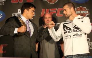 UFC light heavyweight champion Lyoto Machida and challenger Mauricio Rua face-off during a pre-fight press conference Thursday at the Westside Pavilion Mall in Los Angeles. The two will headline Saturday's fight at the Staples Center.