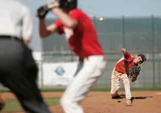 Liberty High baseball pitcher Ryan Popowcer throws during a game Saturday, Oct. 17.