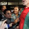 Filipino boxer Manny Pacquiao is led through fans as he arrives at Los Angeles International Airport on Saturday, Oct. 24, 2009.
