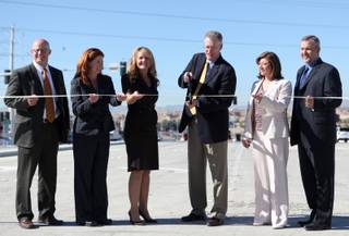 Henderson Mayor Andy Hafen cuts the ribbon during the celebration of the opening of the Galleria Drive Interchange at I-515 Tuesday.

