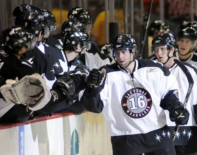 Wranglers left winger Matt Watkins is congratulated by teammates after scoring for Las Vegas in the first period what would become the only goal for the home team on Thursday night.
