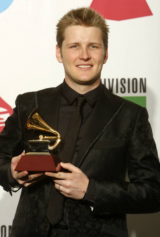 Alexander Acha poses the grammy for New Artist at the 10th annual Latin Grammy awards at the Mandalay Bay Events Center Thursday November 5, 2009. STEVE MARCUS / LAS VEGAS SUN