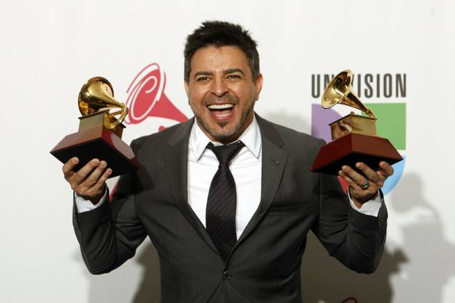 Luis Enrique poses with his awards at the 10th annual Latin Grammy Awards at the Mandalay Bay Events Center Thursday.