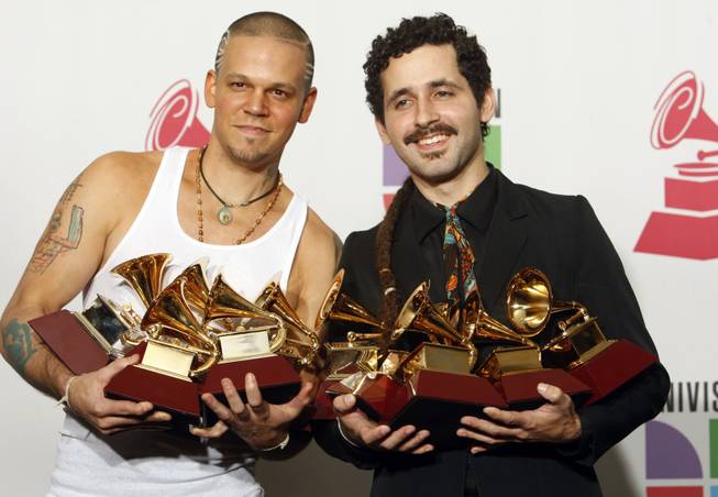 Rene Perez, left, and Eduardo Jose Cabra Martinez of the musical group Calle 13, pose with their awards at the 10th annual Latin Grammy Awards at the Mandalay Bay Events Center Thursday.