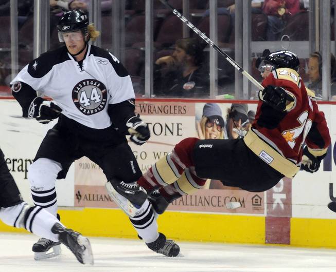 Shay Stephensen (44) sends Bakersfield's Eric Regan flying during the second period at the Orleans on Friday night.