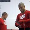 WBO welterweight champion Miguel Cotto, right, of Puerto Rico finishes a workout for the media at the Pound4Pound Gym in Los Angeles on Tuesday, Nov. 3, 2009. Fitness coach Phil Landman is at left. Cotto is scheduled to defend his title against Manny Pacquiao of the Philippines at the MGM Grand Garden Arena on Nov. 14. 