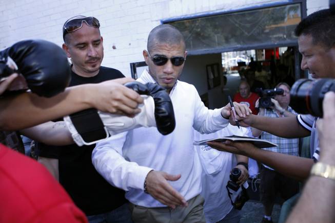 WBO welterweight champion Miguel Cotto of Puerto Rico signs autographs as he leaves the at the Pound4Pound Gym after a media workout in Los Angeles on Tuesday, Nov. 3, 2009. Cotto is scheduled to defend his title against Manny Pacquiao of the Philippines at the MGM Grand Garden Arena on Nov. 14. 