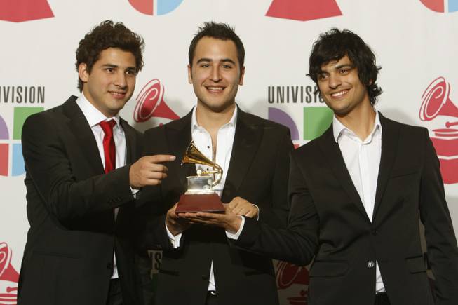 The band Reik hold the award for Best Pop Album by a Duo or Group with Vocal at the 10th annual Latin Grammy Awards at the Mandalay Bay Events Center.