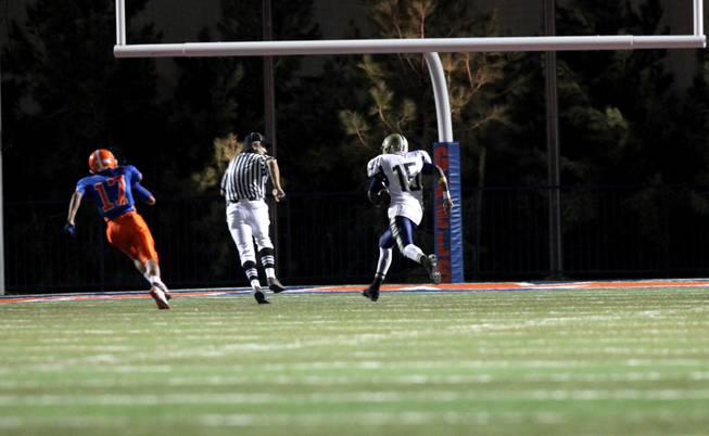 Cheyenne's Marquise Hall runs for a late touchdown Friday in the first round of the Sunset Regional quarterfinals against the Cheyenne. Gorman dominated with a 56-15 victory.