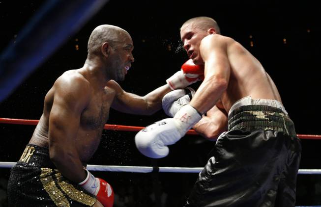 Former WBC lightweight champion Joel Casamayor, left, lands a punch on Jason Davis during an eight-round super lightweight fight at The Pearl in The Palms Friday. Casamayor won the fight by unanimous decision.