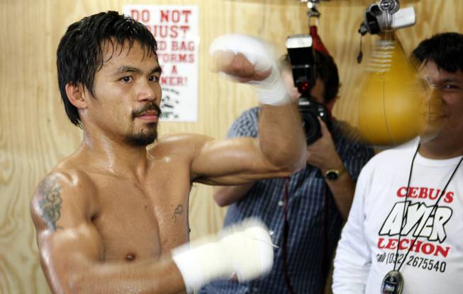 Manny Pacquiao of the Philippines hits a speed bag during ...