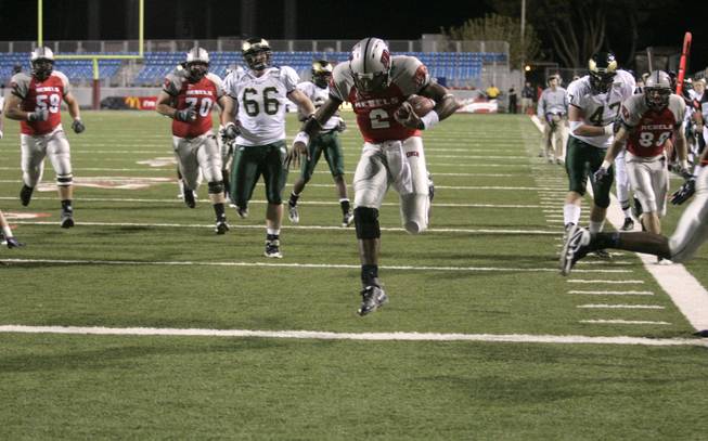 UNLV quarterback Omar Clayton skips over the goal line during the first half of Saturday's game against Colorado State at Sam Boyd Stadium.
