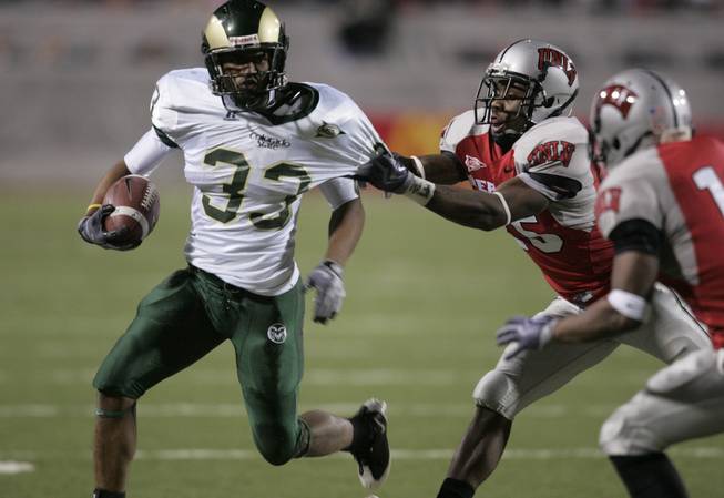 UNLV defensive back Mike Grant loses a tackle on Colorado State running back Lou Greenwook during the second half of their game Saturday, November 7, 2009 at Sam Boyd Stadium.  UNLV won the game 35-16.