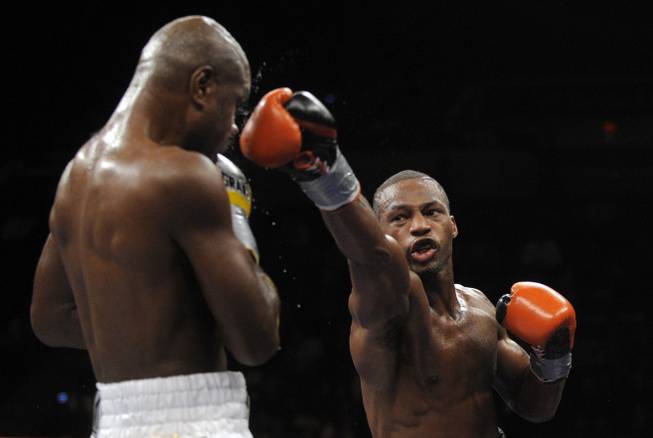 Chad Dawson, right, trades punches with Glen Johnson during their WBC Interim / IBO Light Heavyweight Championship fight in Hartford, Conn., on Saturday, Nov. 7, 2009. Dawson won in 12 rounds with a unanimous decision.