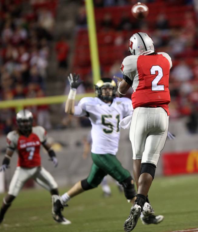 UNLV quarterback Omar Clayton throws a pass to Michael Johnson during the game against Colorado St. at Sam Boyd Stadium Saturday.  UNLV came out on top 35-16..