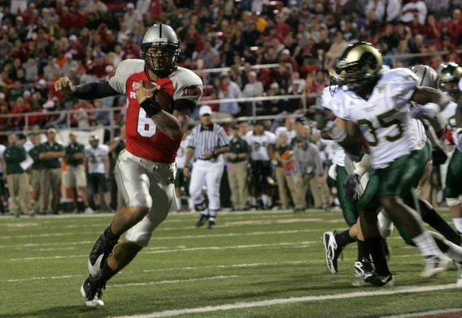 UNLV quarter back Mike Clausen runs in untouched for a touchdown during the game against Colorado St. at Sam Boyd Stadium Saturday. UNLV came out on top 35-16.