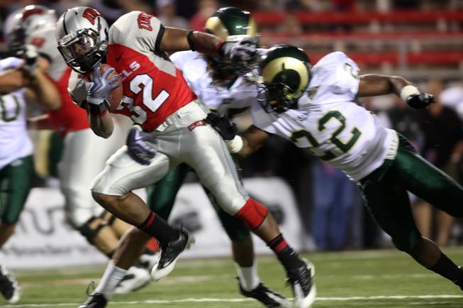 UNLV running back Channing Trotter breaks a tackle during the game against Colorado St. at Sam Boyd Stadium Saturday.  UNLV came out on top 35-16..
