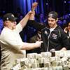 
Darvin Moon, left, a 45-year-old logger from Maryland, holds up the arm of Joe Cada, a 21-year old Internet poker whiz kid from Michigan, after losing to Cada at the World Series of Poker on Nov. 10 at the Rio. Cada won $8.5 million. 