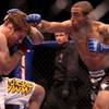 Jose Aldo (right) swings at Mike Brown during the World Featherweight Championship Wednesday at the Palms.  Aldo won with stoppage in the second round.