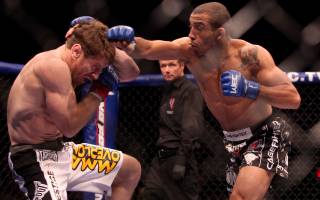 Jose Aldo (right) swings at Mike Brown during the World Featherweight Championship Wednesday at the Palms.  Aldo won with stoppage in the second round.