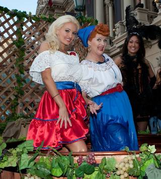 Holly Madison stomps grapes with a Lucille Ball look-alike at the unveiling of Beaujolais Nouveau at the Paris on Nov. 18, 2009.