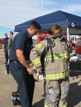 Henderson Councilwoman Gerri Schroder gets ready to fight fire at the Henderson Fire Department's training facility near Warm Springs Road. The Henderson Fire Department invited the  City Council to participate with them in training Wednesday morning, putting three councilwomen and the city clerk through their drills.