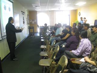 Arcadio Bolonas, director of the Academy of Human Development, gives a presentation about DUI and seat belt fatalities in Nevada to Hispanic residents on Friday.