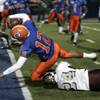 Bishop Gorman quarterback Anu Solomon dives into the end zone against Cimarron-Memorial during the Sunrise Division championship game Friday. Bishop Gorman won the game to advance to the state semifinals.