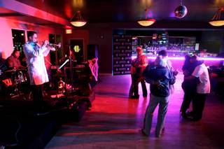 Couples dance to a slow song as the band Blu 7 plays at the Rhythm Kitchen in Las Vegas on Friday, Oct. 30, 2009. 