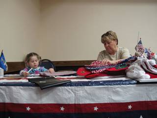 Volunteer Helen Breeden, 62, of Henderson, counts stockings with her granddaughter, Haley Herbolsheimer, 4, at the Henderson Convention Center for an event put on by the Blue Star Mothers of Henderson & Boulder City. The group plans to send 1,000 Christmas stockings overseas to men and women serving in the U.S. armed forces.